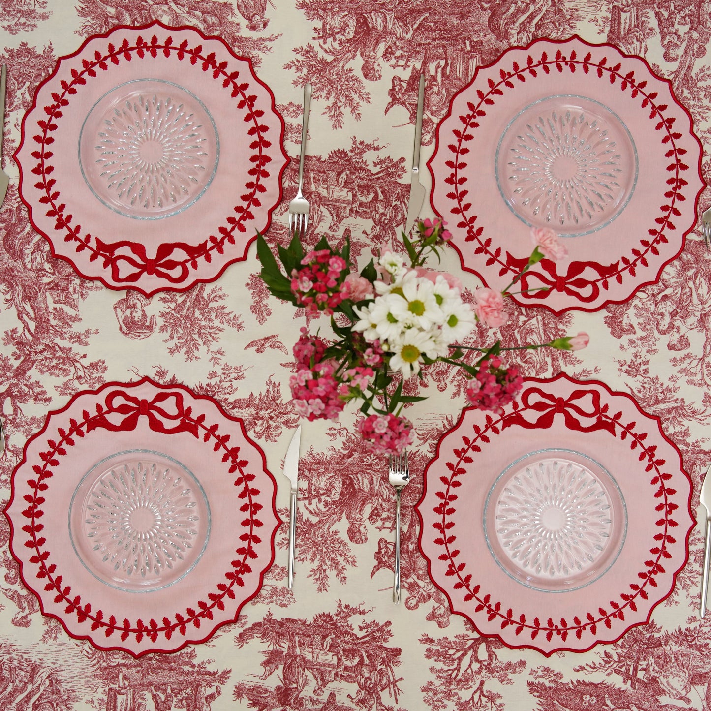 Waterproof Champagne Pink fabric placemat with round shape and embroidered scalloped edges, blending practicality with luxurious handmade dining aesthetics.