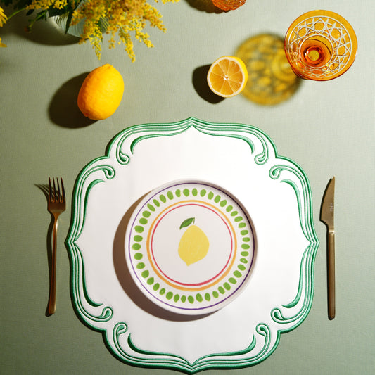 Square faux leather placemat styled with elegant contrast trim for formal dining