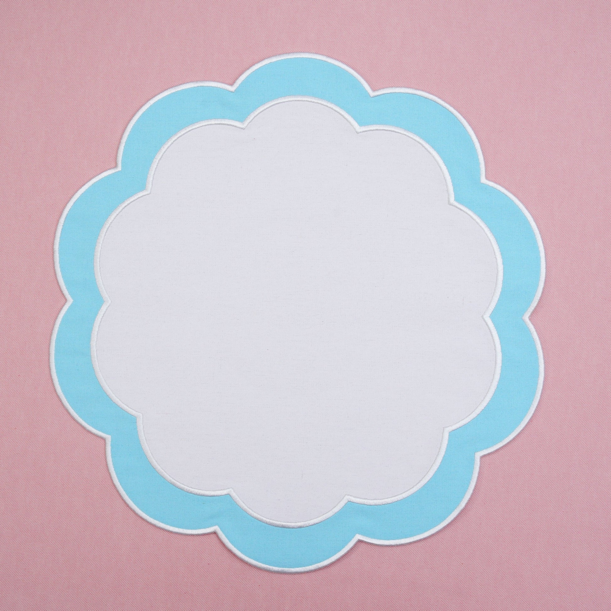 Tabletop layout featuring a refined placemat with smooth finish