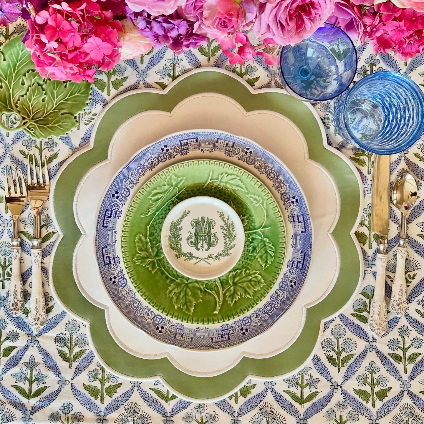 Elegant spring tablescape showing the premium white and green vegan leather mat for sophisticated dining setups