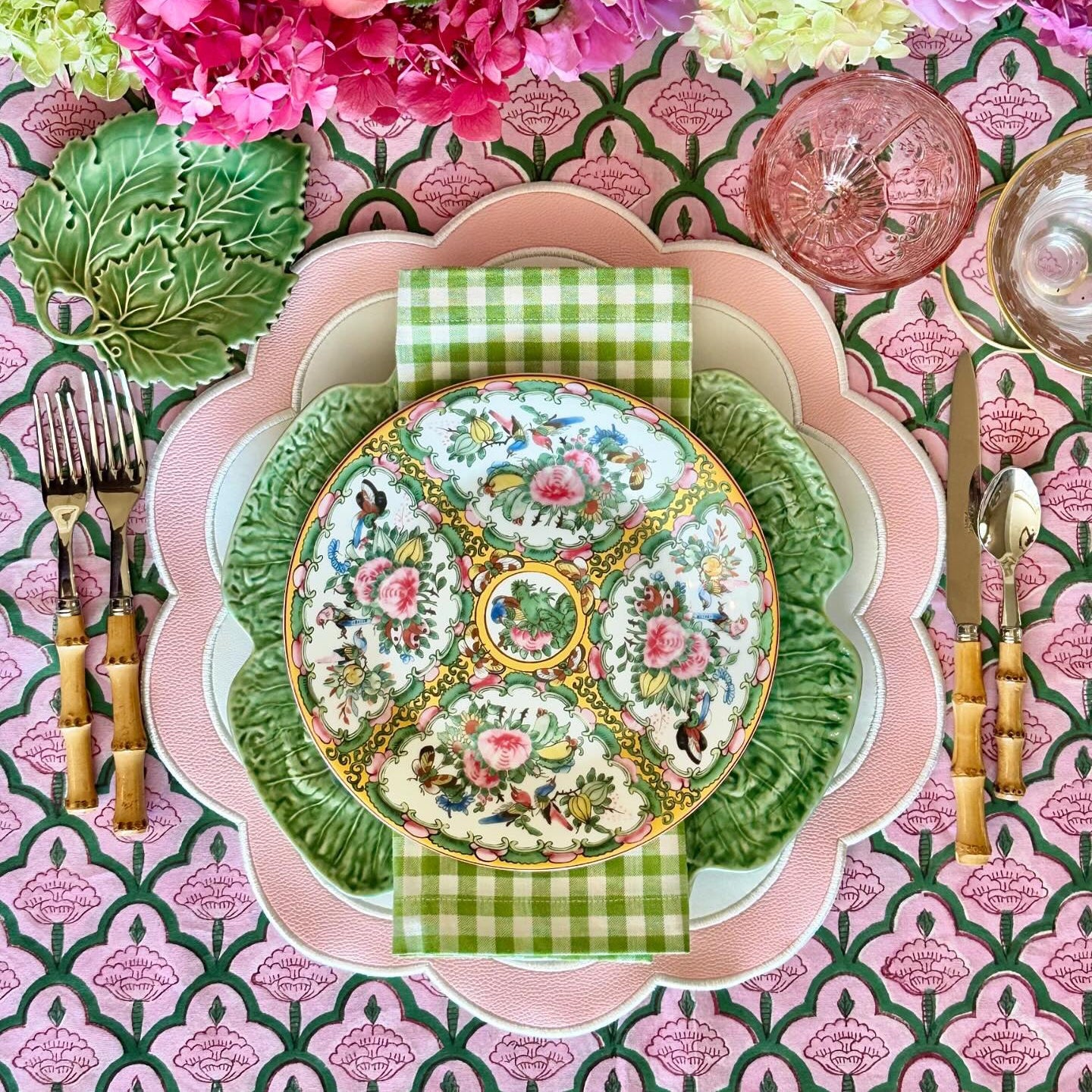 Spring garden party table decor featuring the smooth texture of the Serenity white-pink scalloped placemat