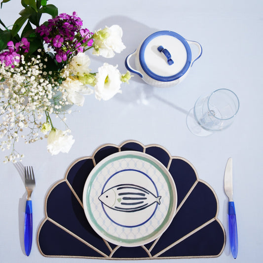 Handcrafted round placemat featuring scalloped edge and decorative trim