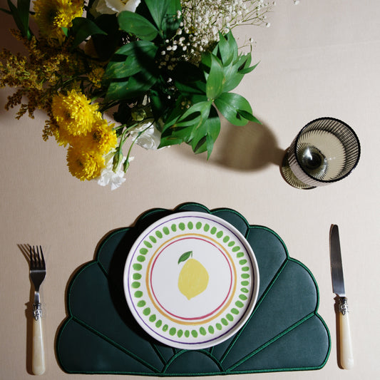 Round scalloped placemat crafted from vegan leather with a detailed finish