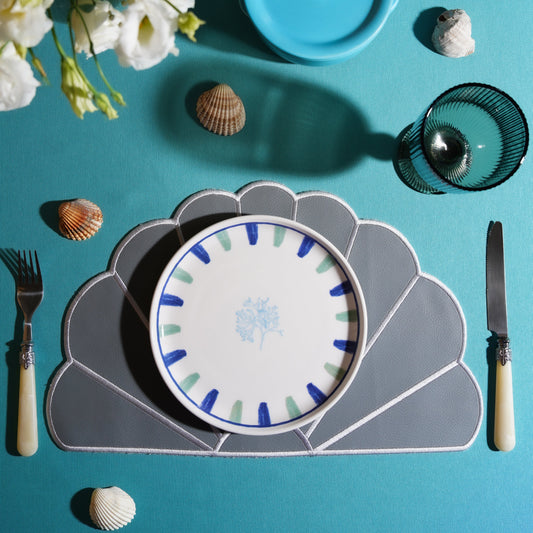 Scalloped vegan leather placemat crafted for refined table settings