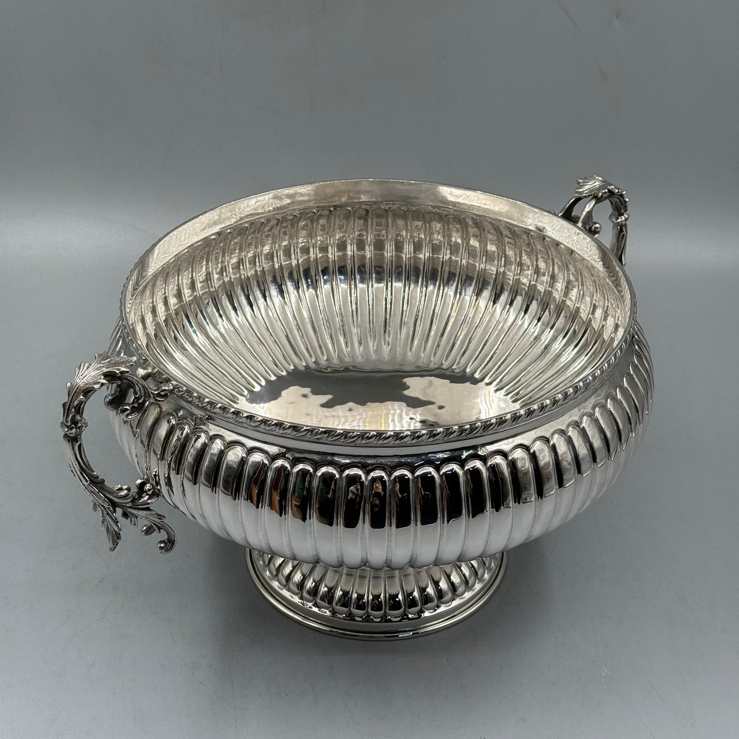 Detail of ornate acanthus leaf scroll handles on silver bowl by PNR Decor ship from USA