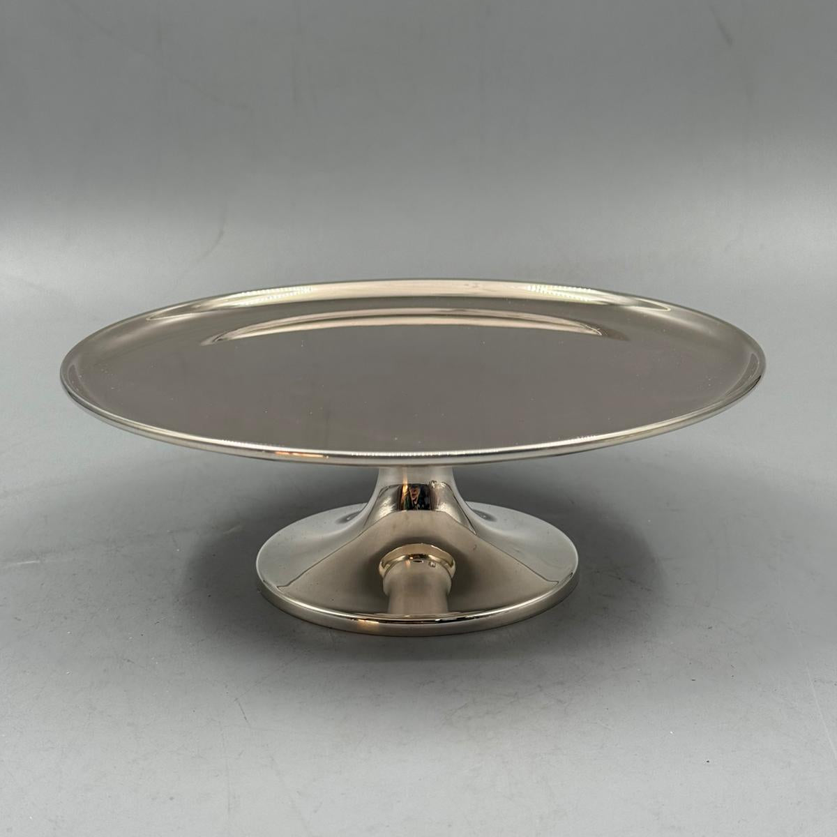 Elegant silver pedestal cake stand with polished round tray for desserts and pastries