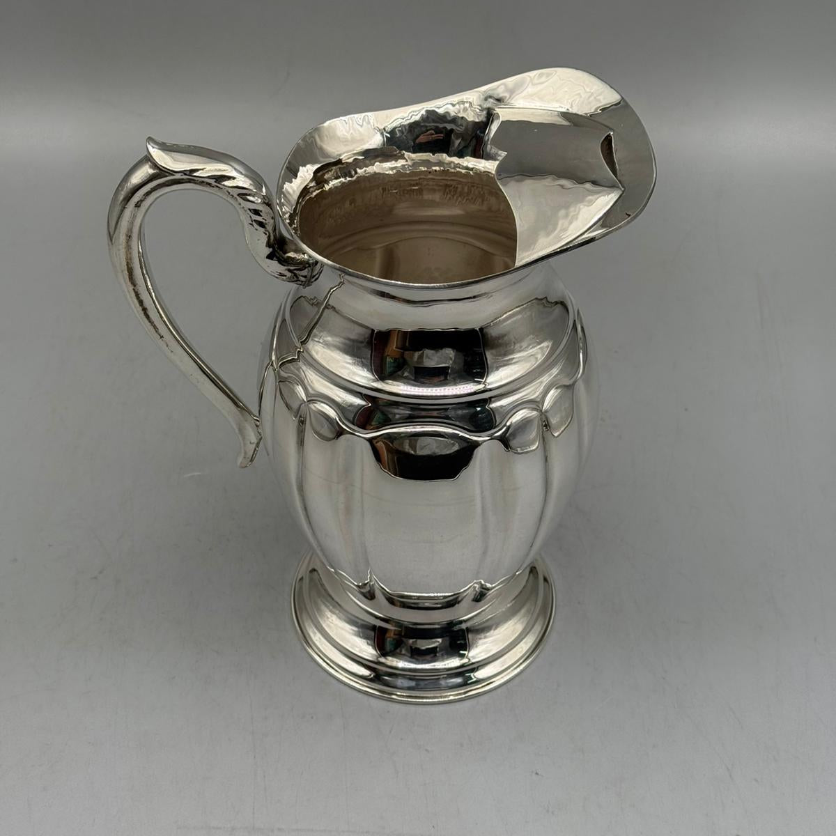 Close up of vertical panel fluting on the body of silver pitcher by PNR Decor ship from USA