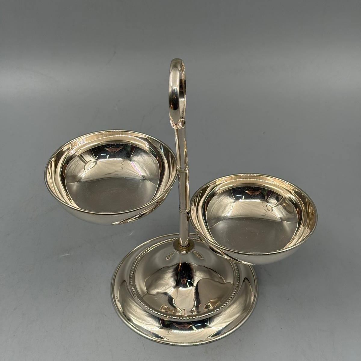 Polished silver snack serving bowls with two compartments on pedestal stand