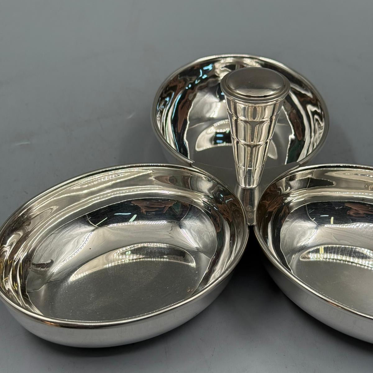 Elegant silver trio serving bowls with central handle for easy table serving