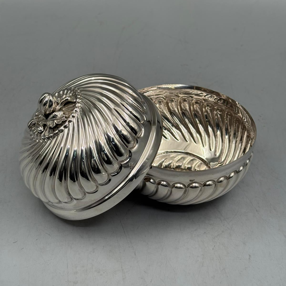 Interior view showing the high-polish finish and the intricate swirled ribbing details of the handcrafted 900 silver statement piece.