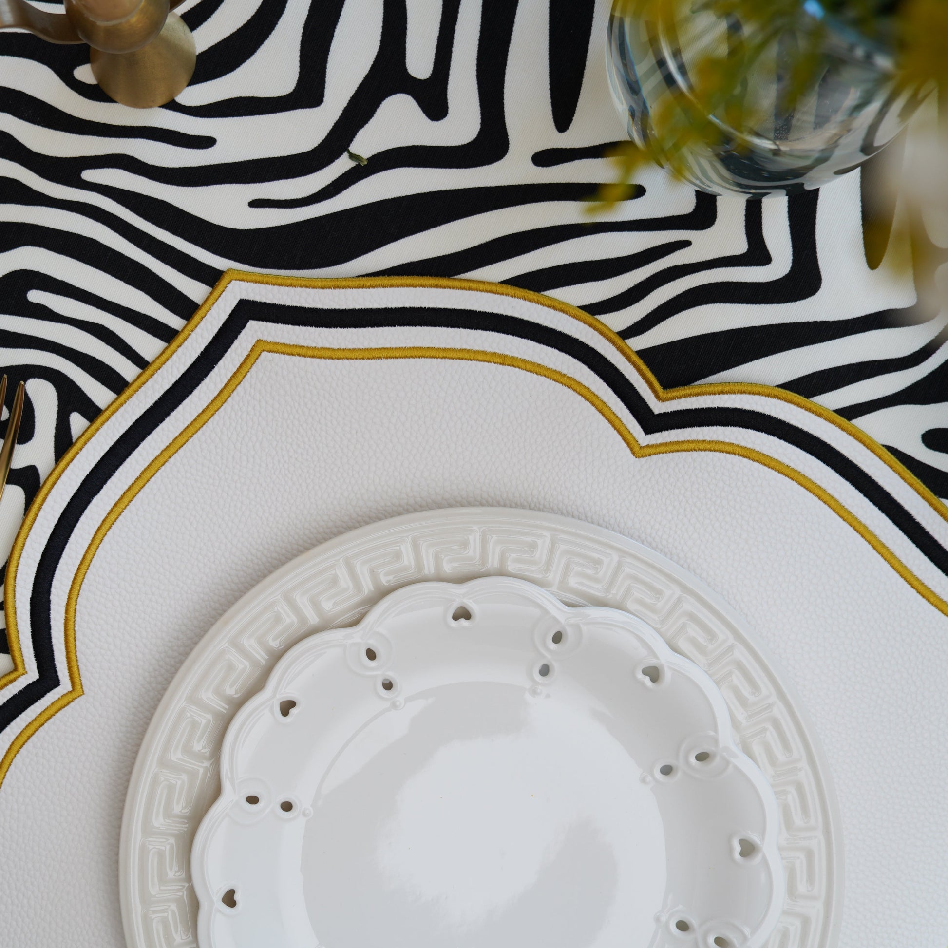 Modern yet timeless, this white square placemat includes contrast edging and is perfect for event tables and formal interiors.
