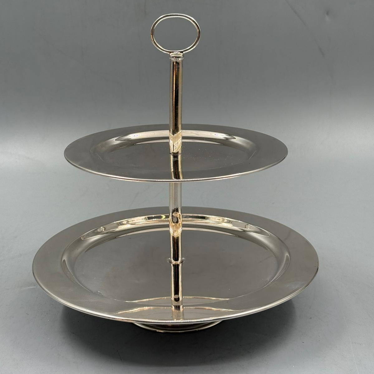 Two tier silver serving stand with round handle, perfect for cakes, fruits, and desserts