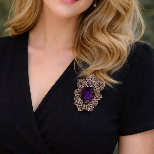 Close up of vintage style brooch with large amethyst purple crystal and antique gold floral leaves by PNR Decor ship from USA