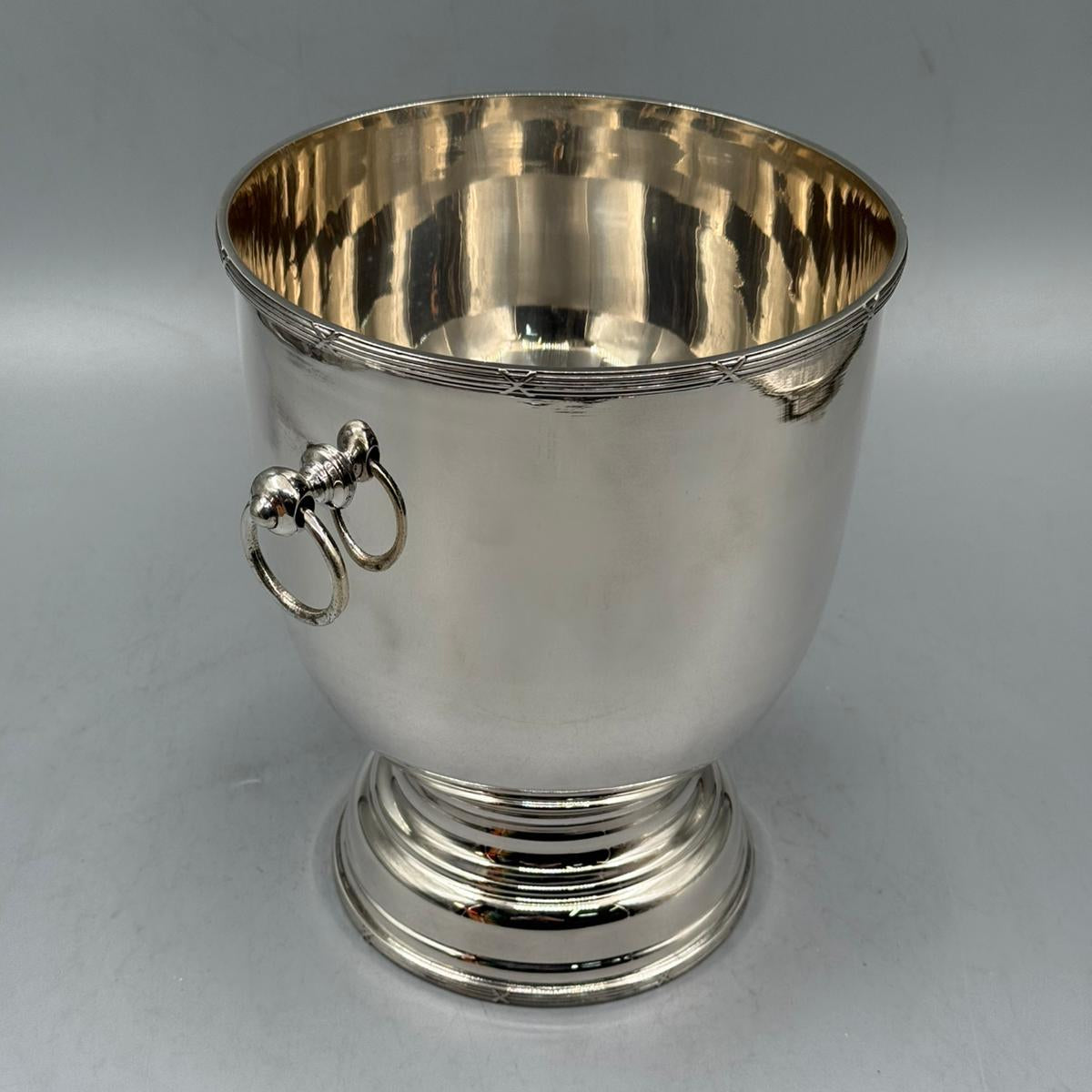 Vintage silver ice bucket with side rings and pedestal base, decorative serving piece