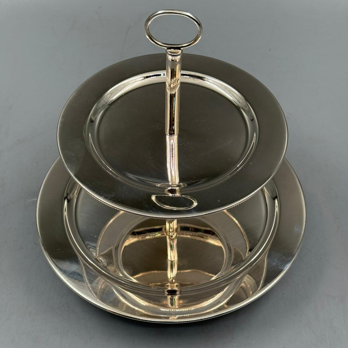Vintage two tier silver serving tray with circular top handle, ideal for high tea and desserts