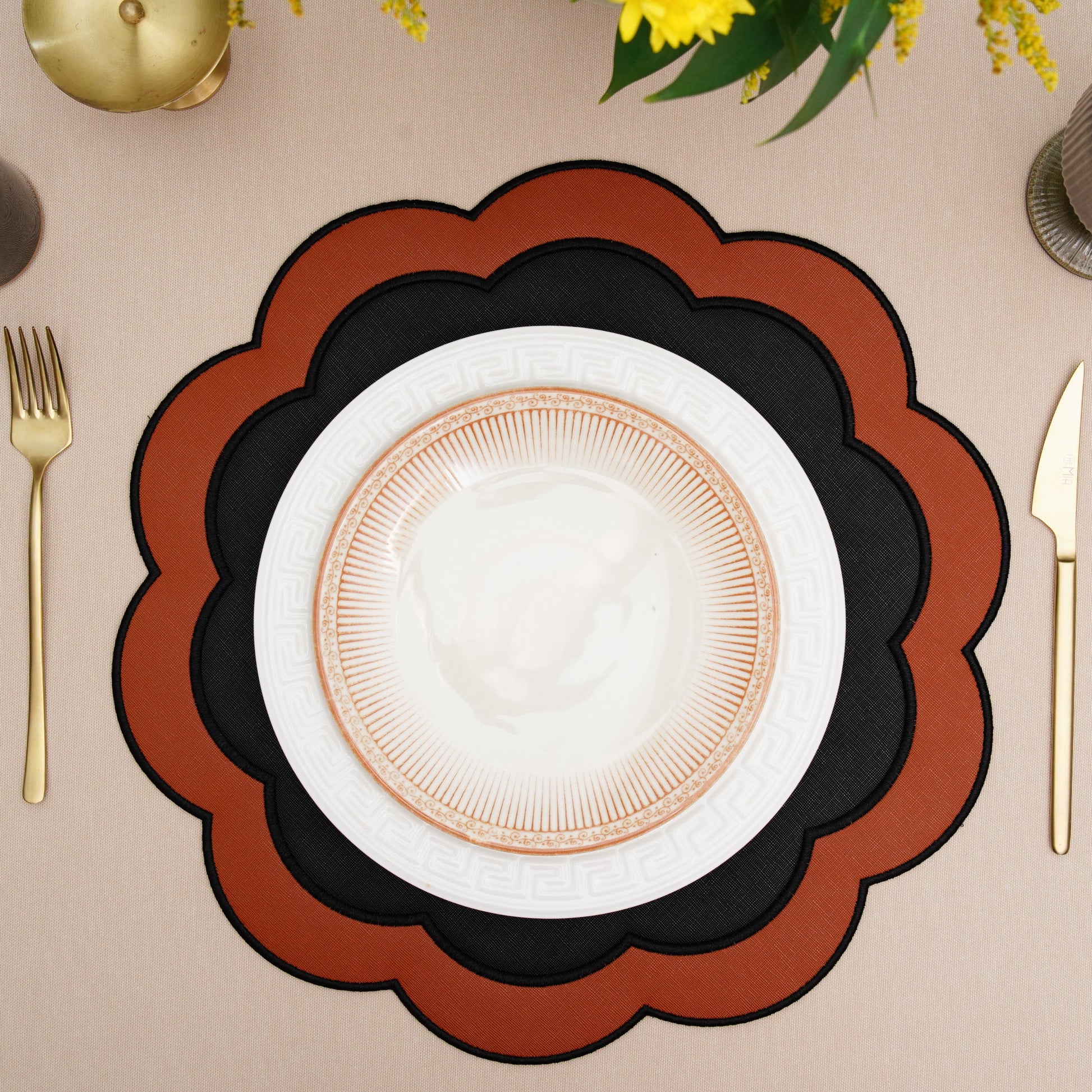 Elegant round placemat displayed with formal dinnerware