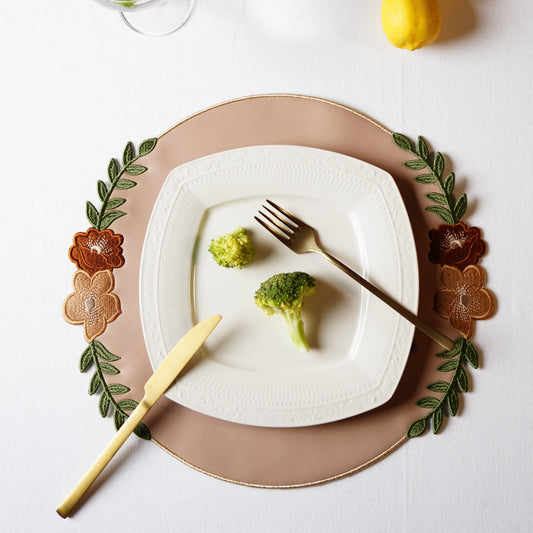 Round vegan leather placemat from the Jasmine collection styled for elegant dining setups