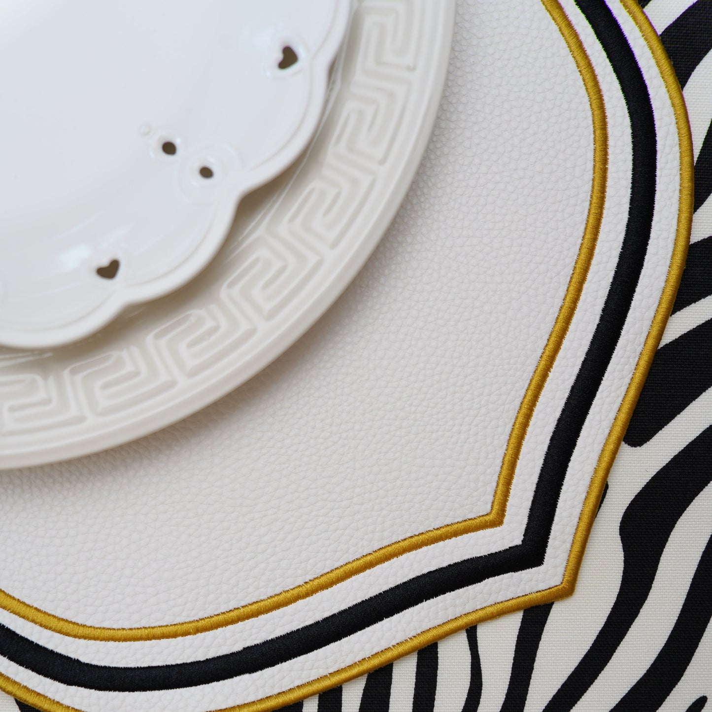 A statement piece for refined table settings, this vegan leather placemat combines elegant structure with practical design.